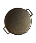 Cast iron skillet with a textured surface on a white background