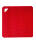 Red silicone mat with honeycomb pattern on a white background