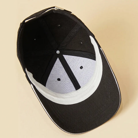 Inside of a baseball cap showing a cap liner in place inside the brim