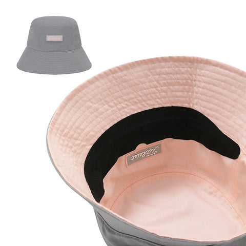 Gray bucket hat with a visible brand label on a white background