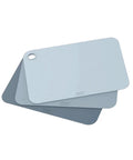 Set of three blue cutting boards with a Joseph Joseph logo on a white background