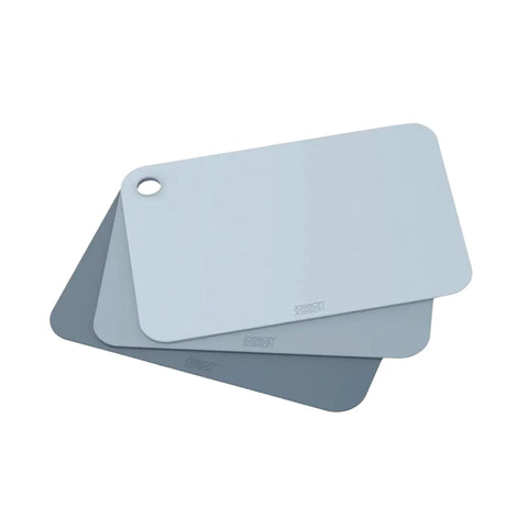 Set of three blue cutting boards with a Joseph Joseph logo on a white background