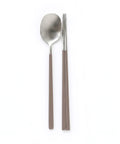 Stainless steel spoon and chopsticks on a white background