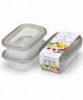 Two clear plastic rectangular storage containers with translucent lids are shown on white background along with their printed retail packaging. The packaging features a white band with colorful food illustrations and Japanese text.