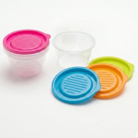 Set of colorful plastic lids on a white background