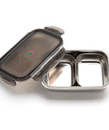 Stainless steel food container with a black lid on a white background