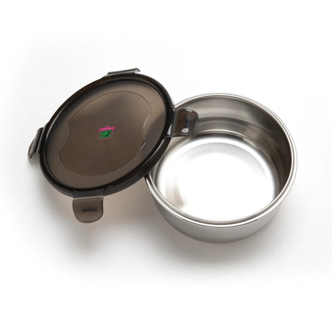 Stainless steel food container with black lid on a white background