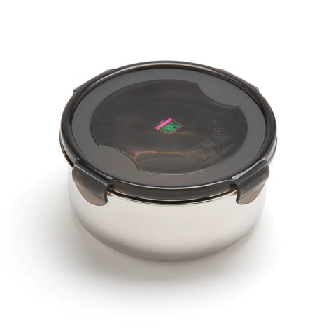 Stainless steel food container with black lid on a white background