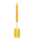 A yellow foam cleaning brush with a bright orange handle and a white plastic stem, shown against a plain white background.