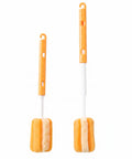 Two orange and white cleaning brushes with sponge heads, shown on a plain white background.
