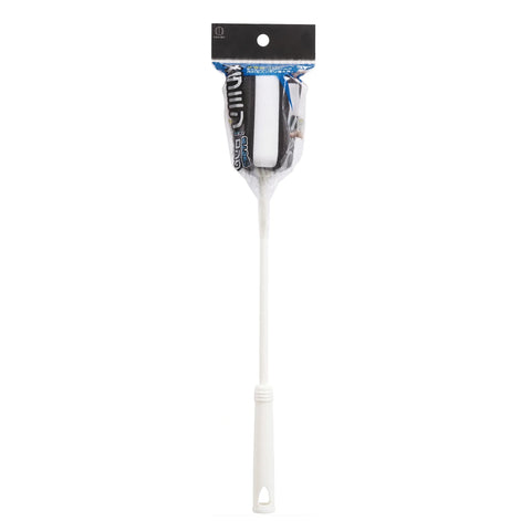 A long-handled cleaning brush with a white plastic handle and a black-and-white bristle head, packaged in clear plastic with a black header card on a white background.