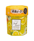 A hexagonal container of Shosyu Fresh Lemon room freshener, featuring a bright yellow lid and a clear lower section filled with yellow liquid and printed lemon and daisy illustrations.