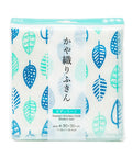 A packaged kitchen cloth set shown on a plain white background. The product is a set of white kitchen towels with a repeating leaf pattern in shades of blue and teal, sealed in clear plastic packaging with a turquoise header card and Japanese text.