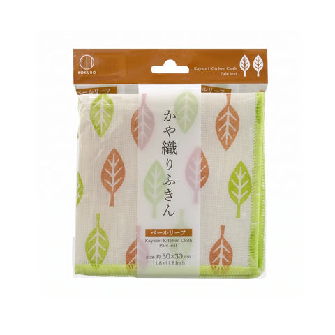 A packaged Kayosi kitchen cloth set with a leaf pattern on a white background. The set includes two green fringed kitchen cloths and two pink fringed kitchen cloths, wrapped in clear plastic with a brown cardboard header.