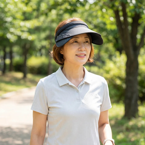 Woman wearing a black visor outdoors