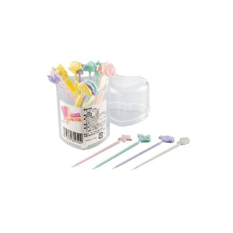A set of pastel-colored tooth picks with decorative shapes, shown in a clear cylindrical container with a heart-shaped lid, plus four loose picks displayed in front on a white background.