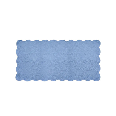 Rectangular blue placemat with scalloped edge on a white background
