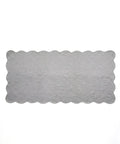 Rectangular gray rug with scalloped edge on a white background