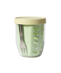 Green container with a beige lid and a fork inside on a white background