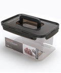 Modular food container with black lid and handle on a white background
