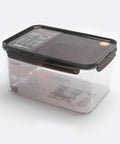 Clear storage container with black lid on a white background
