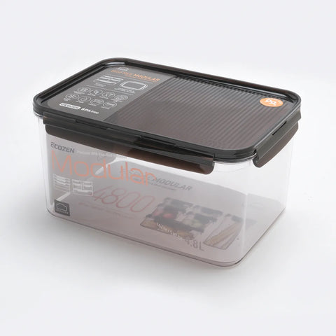 Clear storage container with black lid on a white background