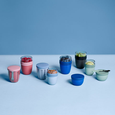 Collection of colorful containers on a light blue background
