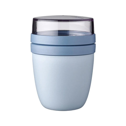 Light blue tumbler with a clear lid on a white background