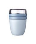 Light blue tumbler with a clear lid on a white background