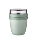 Green tumbler with a clear lid on a white background