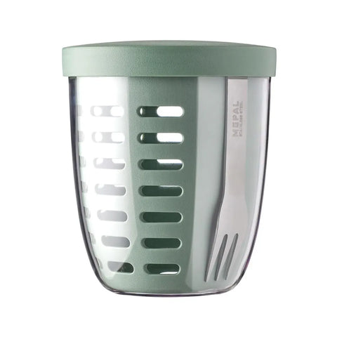 Mint green tumbler with a clear body on a white background