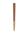 Pair of brown and wooden chopsticks on a white background