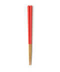 Pair of red and gold chopsticks on a white background