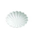 A small white ceramic plate with a scalloped, petal-like rim and a subtle radial ribbed pattern, shown on a solid white background.