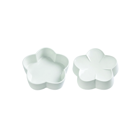 Two small flower-shaped ceramic dishes or containers shown on a plain white background, one open and one closed.