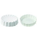 Two small round scalloped tart pans in a very pale mint green color, shown on a plain white background.