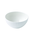 A white ceramic bowl with a fluted, ribbed exterior and a smooth, slightly tapered interior, shown against a plain white background.