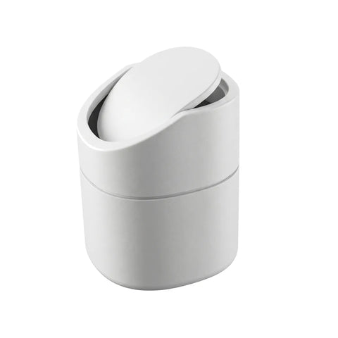 White mini trash can with a lid on a white background