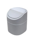 Gray trash can with a white lid on a white background