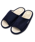 A pair of navy blue open-toe slip-on slippers with textured beige footbeds, shown on a plain white background.