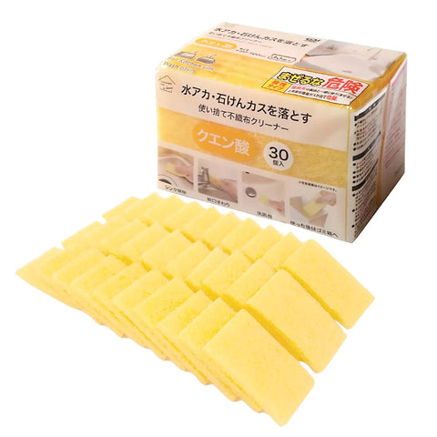 Yellow rectangular sponge cleaning blocks arranged in front of a product box with Japanese text on a white background.