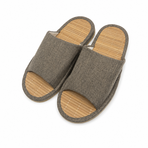 A pair of open-toe slip-on slippers with a textured gray fabric upper and a natural bamboo-look footbed, shown on a plain white background.