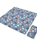 Children's foldable blanket with colorful monster pattern on a white background