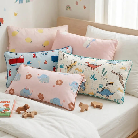 Set of colorful children's pillows on a bed with toys around
