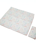 Patterned kids blanket and pillow set on a white background