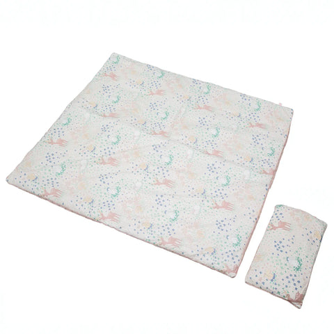 Patterned kids blanket and pillow set on a white background