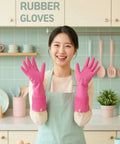 Person wearing pink rubber gloves in a kitchen setting