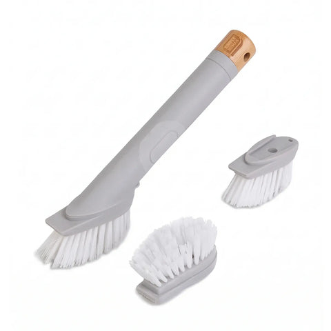 Set of cleaning brushes with gray handles and white bristles on a white background