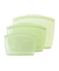 Set of three light green silicone pouches on a white background