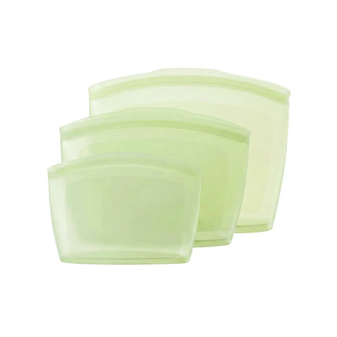 Set of three light green silicone pouches on a white background
